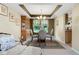 Dining room with glass table set, classic hutch, and bright natural light at 6439 Bower Dr, Indianapolis, IN 46241