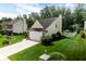 A well-kept home with a lush green lawn and inviting curb appeal in a quiet neighborhood at 6439 Bower Dr, Indianapolis, IN 46241