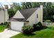 Charming home featuring a well-manicured lawn, attached garage, and inviting curb appeal at 6439 Bower Dr, Indianapolis, IN 46241