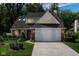 Charming home with a two-car garage, well-manicured lawn, and inviting curb appeal at 6439 Bower Dr, Indianapolis, IN 46241