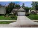 Charming home exterior with a well-manicured lawn, driveway, and a two-car garage at 6439 Bower Dr, Indianapolis, IN 46241