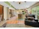 Spacious kitchen and adjacent living area with warm wood floors and modern appliances at 6439 Bower Dr, Indianapolis, IN 46241