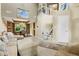 Open living space featuring tall ceilings, elegant decor, and access to a dining area at 6439 Bower Dr, Indianapolis, IN 46241