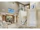 Bright living room with high ceilings, dining area, and stair lift for accessibility at 6439 Bower Dr, Indianapolis, IN 46241