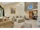 Bright living room boasts vaulted ceilings, neutral tones, and comfortable seating arrangement at 6439 Bower Dr, Indianapolis, IN 46241