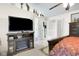 Spacious primary bedroom featuring a TV, fireplace, and en suite bathroom access at 6439 Bower Dr, Indianapolis, IN 46241