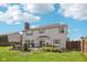 A spacious backyard with a patio and lush lawn is the perfect place to enjoy the outdoors at 6622 W Dickens Xing, McCordsville, IN 46055