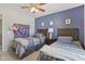 Stylish blue bedroom with two beds, decorated with airplane toys and posters for a fun, playful vibe at 6622 W Dickens Xing, McCordsville, IN 46055