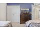 Bedroom featuring a large dresser, a TV, neutral walls, soft carpet and a double door closet at 6622 W Dickens Xing, McCordsville, IN 46055