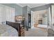 Bedroom showing bed, dresser and adjacent entry at 6622 W Dickens Xing, McCordsville, IN 46055