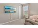 Comfortable carpeted bedroom featuring a mounted TV and cozy seating area by the window at 6622 W Dickens Xing, McCordsville, IN 46055