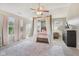 Charming primary bedroom featuring a four post bed, neutral carpet and curtains, and vaulted ceilings at 6622 W Dickens Xing, McCordsville, IN 46055