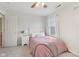 Bright bedroom featuring a cozy pink bedspread, a window with natural light and neutral walls at 6622 W Dickens Xing, McCordsville, IN 46055
