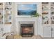 Elegant fireplace with a decorative mantel, built-in bookshelves, and contemporary decor at 6622 W Dickens Xing, McCordsville, IN 46055