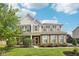 Charming two-story home with a brick and siding facade, lush landscaping, and a well-maintained front yard at 6622 W Dickens Xing, McCordsville, IN 46055