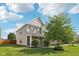 Charming two-story home with brick accents, shutters, and a well-manicured lawn on a sunny day at 6622 W Dickens Xing, McCordsville, IN 46055