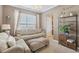 Cozy living room with a large window and comfortable furniture at 6622 W Dickens Xing, McCordsville, IN 46055