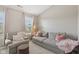 Cozy living room with comfortable seating, soft lighting, and neutral colors at 6622 W Dickens Xing, McCordsville, IN 46055