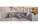 Spacious living room featuring a comfortable sectional sofa, contemporary decor, and ample natural light at 6622 W Dickens Xing, McCordsville, IN 46055