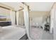 Spacious bedroom featuring a four poster bed frame, neutral walls, and large mirror at 6622 W Dickens Xing, McCordsville, IN 46055