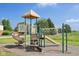 A vibrant neighborhood playground with slides, climbing structure, and swings at 6622 W Dickens Xing, McCordsville, IN 46055