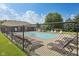 Community swimming pool with plenty of lounge chairs for relaxation, offering a refreshing outdoor amenity at 6622 W Dickens Xing, McCordsville, IN 46055