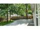 Spacious backyard deck surrounded by trees and greenery, creating a relaxing outdoor space at 6816 Minnow Dr, Indianapolis, IN 46237