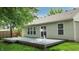Spacious backyard deck, perfect for outdoor entertaining and relaxation, with a landscaped yard at 6816 Minnow Dr, Indianapolis, IN 46237