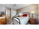 Cozy bedroom featuring neutral walls, ceiling fan, and a comfortable-looking single bed with side tables at 6816 Minnow Dr, Indianapolis, IN 46237