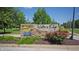 Welcome to Waters Edge: a community with beautiful landscaping, a decorative entrance sign, and a warm, inviting atmosphere at 6816 Minnow Dr, Indianapolis, IN 46237