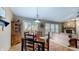 Inviting dining area featuring a wooden table with seating for four, seamlessly connected to the cozy living room at 6816 Minnow Dr, Indianapolis, IN 46237