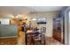 Cozy dining area with adjacent kitchen featuring warm finishes at 6816 Minnow Dr, Indianapolis, IN 46237