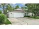 Charming home exterior with a two-car garage, well-manicured lawn, and curb appeal at 6816 Minnow Dr, Indianapolis, IN 46237
