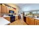 Well-lit kitchen with wood cabinets, black appliances, a double basin sink, and lots of counter space at 6816 Minnow Dr, Indianapolis, IN 46237