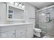 Modern bathroom featuring a double vanity, a glass-enclosed shower, and sleek fixtures at 770 Viewpoint Dr, Plainfield, IN 46168