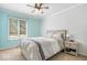 Comfortable bedroom with a large window offering natural light and a neutral color palette at 770 Viewpoint Dr, Plainfield, IN 46168