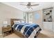 Well-lit bedroom featuring a ceiling fan, built-in shelving, and a serene atmosphere at 770 Viewpoint Dr, Plainfield, IN 46168