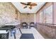 Charming covered patio with brick accents, ceiling fan, furniture, and outdoor grill at 770 Viewpoint Dr, Plainfield, IN 46168