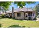 Brick home's exterior view showcases a well-maintained yard and screened-in porch at 770 Viewpoint Dr, Plainfield, IN 46168