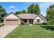 Charming ranch home with brick facade, attached garage, and beautifully maintained lawn at 770 Viewpoint Dr, Plainfield, IN 46168
