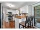 Updated kitchen with white cabinetry, stainless steel appliances, and breakfast bar seating at 770 Viewpoint Dr, Plainfield, IN 46168