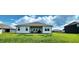 Lush backyard with a covered patio and plenty of green space, great for outdoor activities at 7808 Grande Oaks Dr, Plainfield, IN 46168