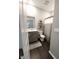 A compact bathroom with a single sink vanity and storage at 7808 Grande Oaks Dr, Plainfield, IN 46168