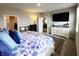 Bedroom with floral bedding, dresser, TV, and walk-in closet access at 7808 Grande Oaks Dr, Plainfield, IN 46168