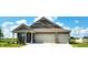 Charming home with a two-car garage, beautiful color palette, and well-maintained lawn at 7808 Grande Oaks Dr, Plainfield, IN 46168