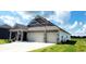 Charming home with a two-car garage, beautiful color palette, and well-maintained lawn at 7808 Grande Oaks Dr, Plainfield, IN 46168