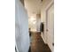 Bright hallway leading to a bathroom with a glass-enclosed shower and neutral-toned decor at 7808 Grande Oaks Dr, Plainfield, IN 46168