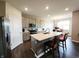 Spacious kitchen with stainless steel appliances, a center island, and an adjacent dining area at 7808 Grande Oaks Dr, Plainfield, IN 46168