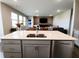 Open kitchen and living area perfect for entertaining with spacious countertops at 7808 Grande Oaks Dr, Plainfield, IN 46168