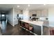 Modern kitchen with stainless steel appliances, a large island, and gray cabinets at 7808 Grande Oaks Dr, Plainfield, IN 46168